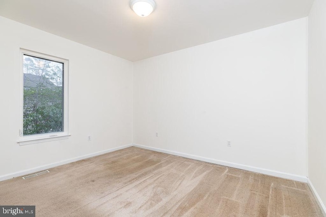 empty room with carpet flooring