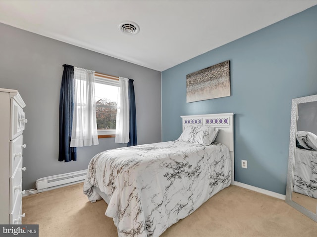 carpeted bedroom with baseboard heating