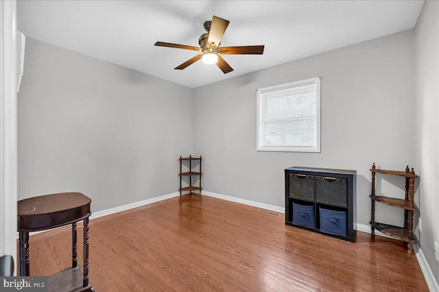 miscellaneous room with hardwood / wood-style flooring and ceiling fan