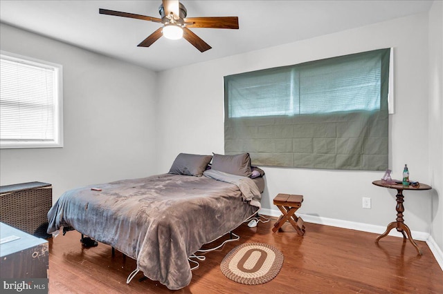 bedroom featuring wood-type flooring and ceiling fan