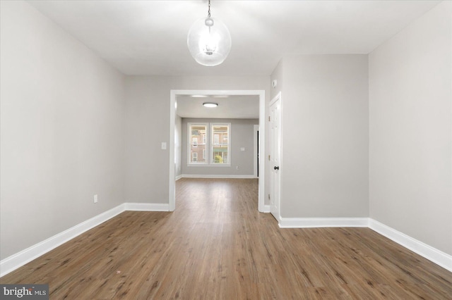 unfurnished room featuring hardwood / wood-style floors