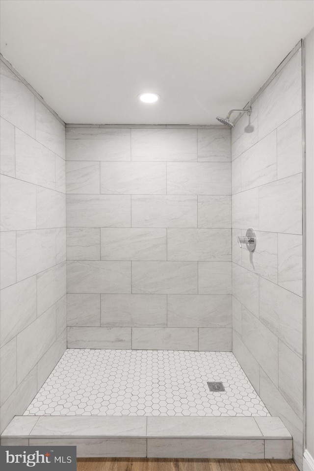 bathroom with tiled shower