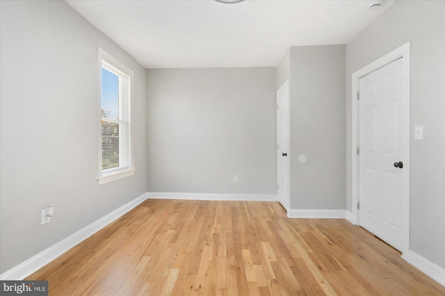 spare room with light hardwood / wood-style flooring