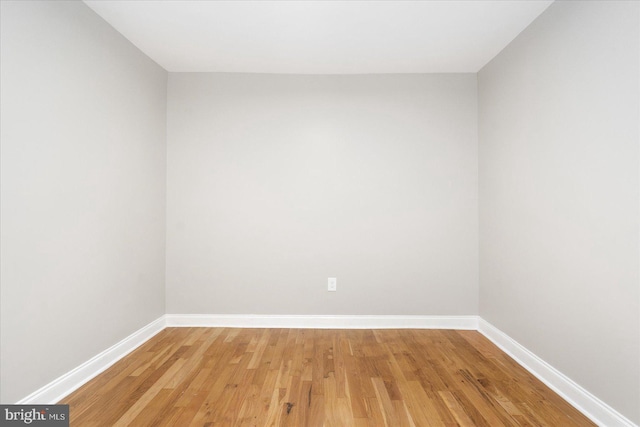 spare room featuring hardwood / wood-style flooring