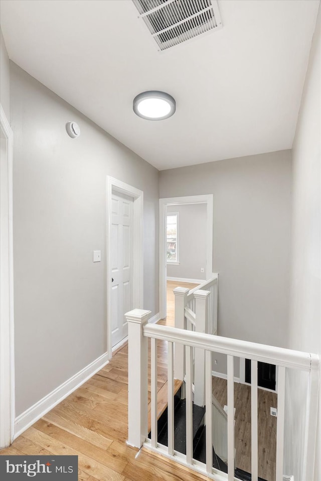 hallway featuring wood-type flooring