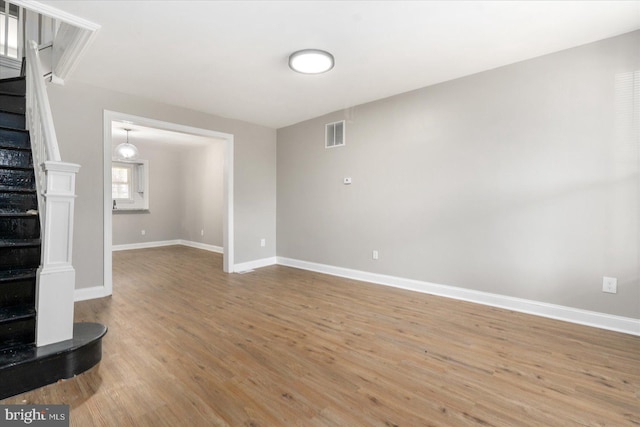 unfurnished living room featuring light hardwood / wood-style flooring