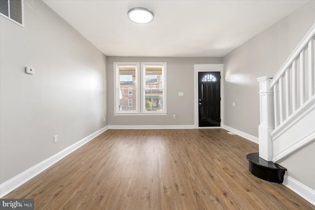 entryway with wood-type flooring