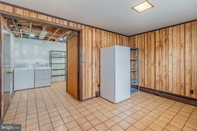 interior space featuring washer and dryer and wooden walls