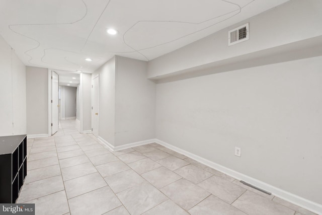 basement with light tile patterned floors