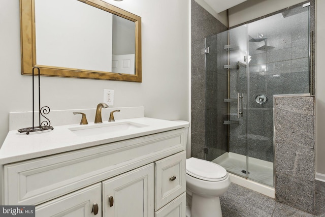 bathroom featuring vanity, toilet, and walk in shower