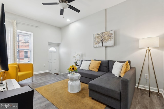 living room with hardwood / wood-style floors and ceiling fan