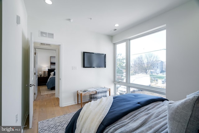 bedroom with light hardwood / wood-style flooring