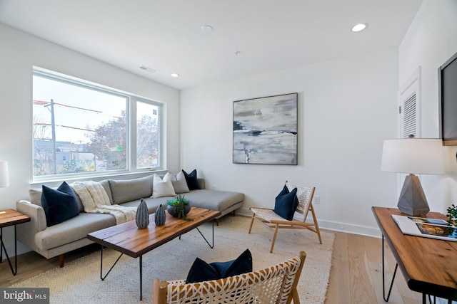 living room with light hardwood / wood-style flooring