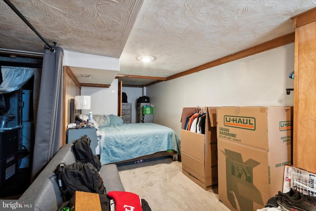 bedroom featuring crown molding, carpet floors, and a textured ceiling