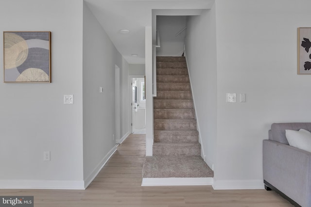 staircase featuring hardwood / wood-style floors