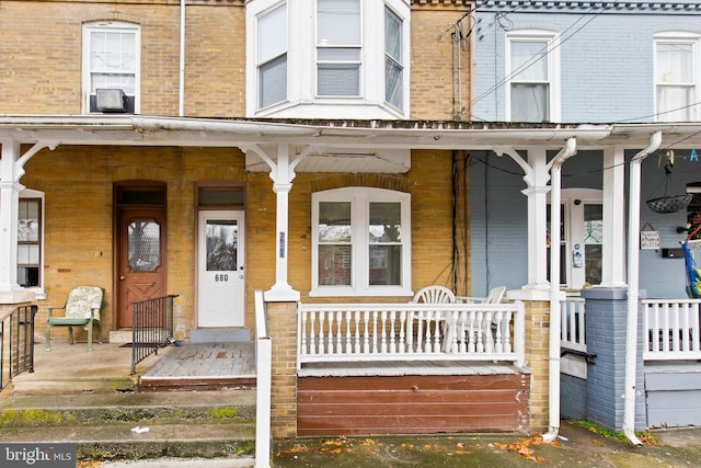 doorway to property with a porch