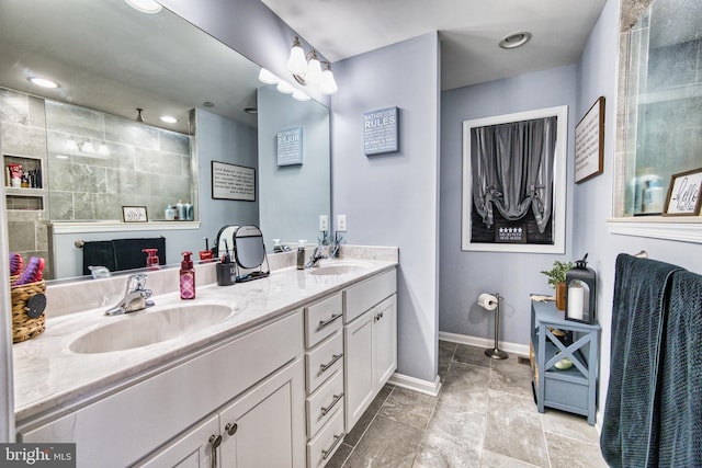 bathroom featuring vanity and a shower