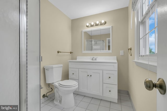 bathroom featuring tile patterned floors, vanity, and toilet