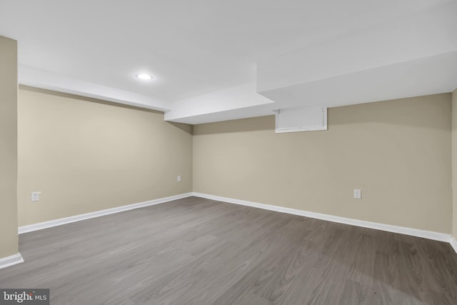 basement featuring hardwood / wood-style flooring