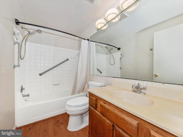 full bathroom with hardwood / wood-style floors, vanity, toilet, and shower / bath combination with curtain