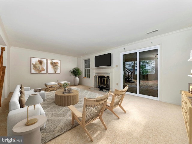 living room with crown molding and light colored carpet