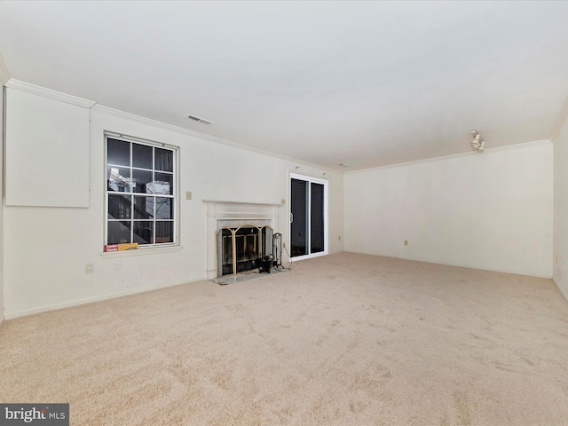 unfurnished living room with carpet and ornamental molding