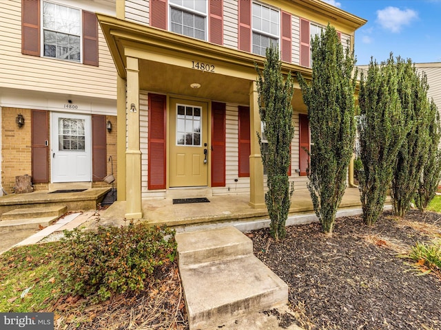 doorway to property featuring a porch