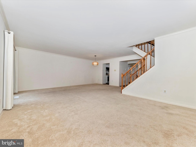 unfurnished living room featuring light colored carpet and crown molding