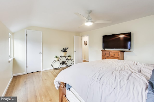 bedroom featuring vaulted ceiling, ceiling fan, and light hardwood / wood-style floors