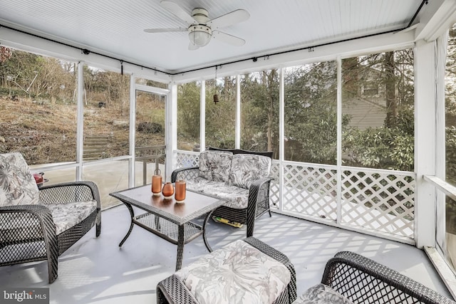 sunroom / solarium with ceiling fan