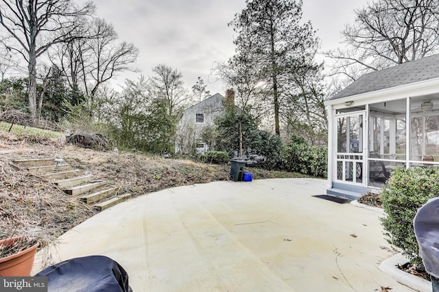 view of patio / terrace featuring a sunroom