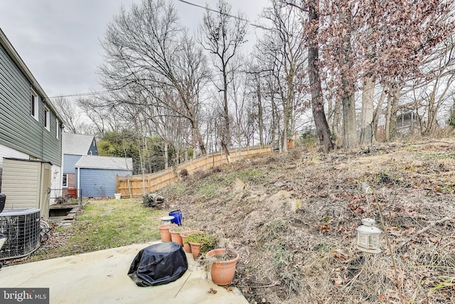 view of yard with a patio and central AC unit