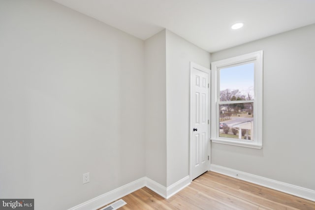 unfurnished room featuring light wood-type flooring