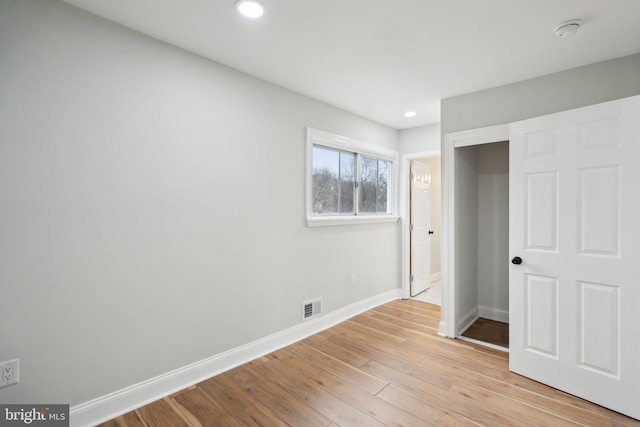 unfurnished bedroom featuring light wood-type flooring