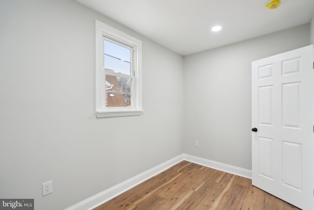 unfurnished room with light hardwood / wood-style flooring