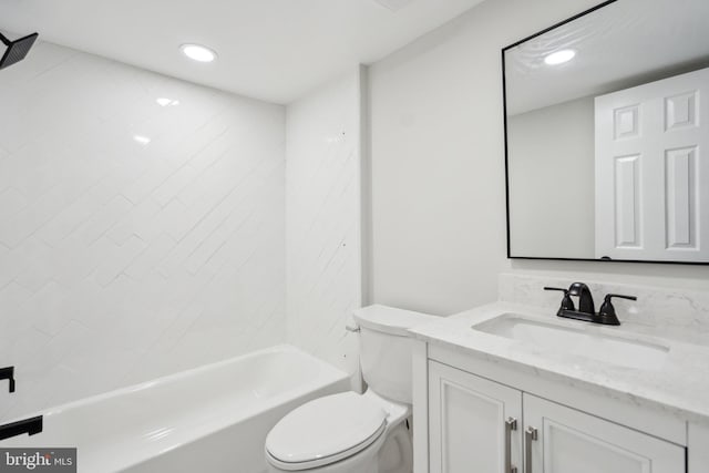 full bathroom with tiled shower / bath combo, vanity, and toilet