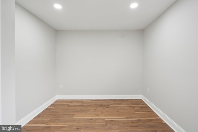 empty room with hardwood / wood-style flooring