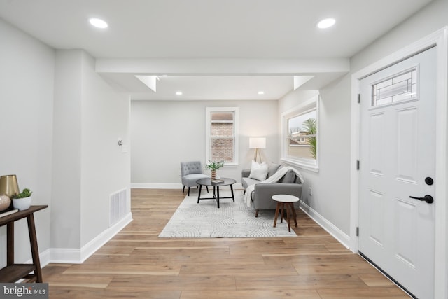 sitting room with light hardwood / wood-style floors