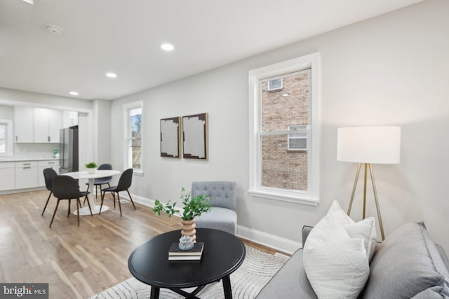 living room with light hardwood / wood-style flooring