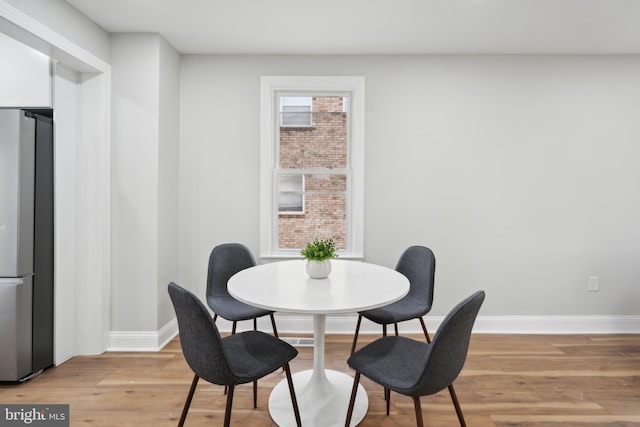 dining room with light hardwood / wood-style flooring