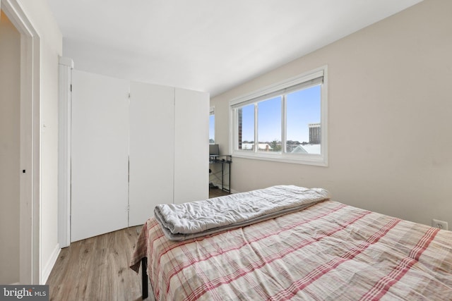 bedroom with light hardwood / wood-style floors