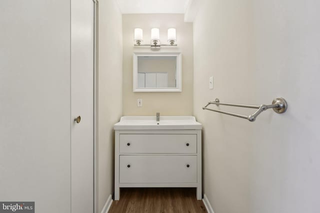 bathroom featuring vanity and hardwood / wood-style flooring