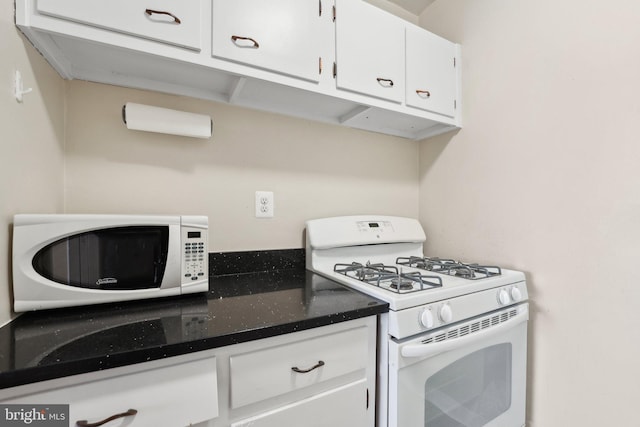 kitchen with white cabinets and white appliances