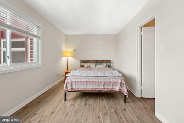 bedroom with light hardwood / wood-style floors