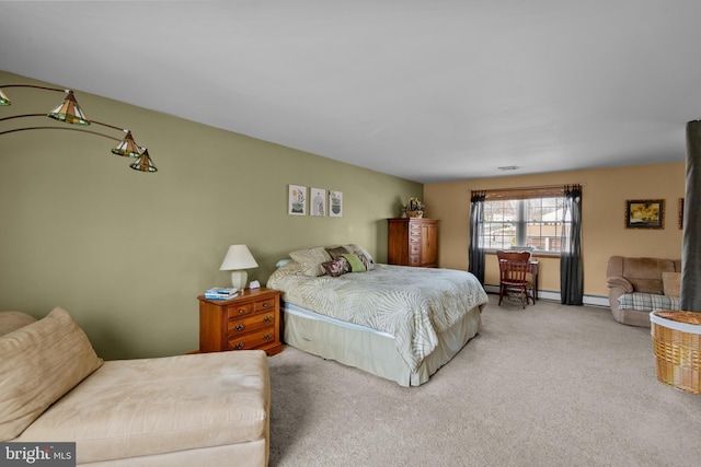 carpeted bedroom featuring a baseboard radiator