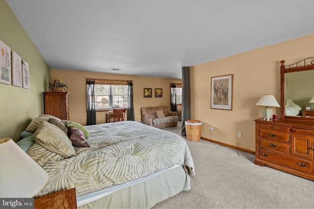 bedroom with light colored carpet