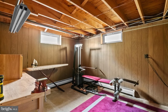 exercise room featuring wooden walls