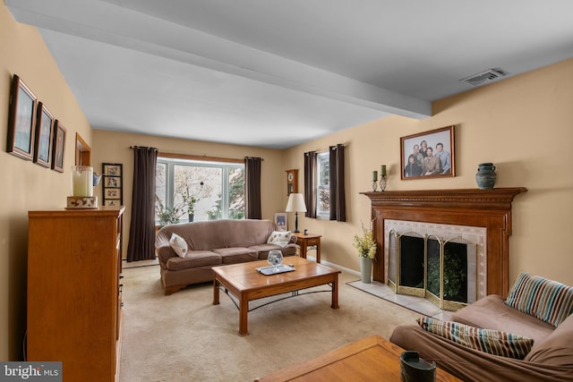 living room featuring light colored carpet and beam ceiling