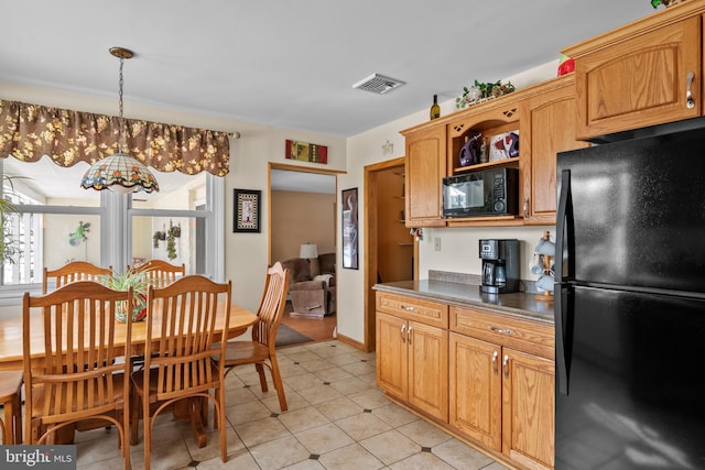 kitchen with black appliances, pendant lighting, a chandelier, and light tile patterned floors