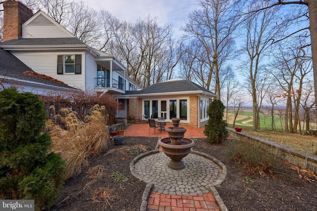 back of house with a patio area